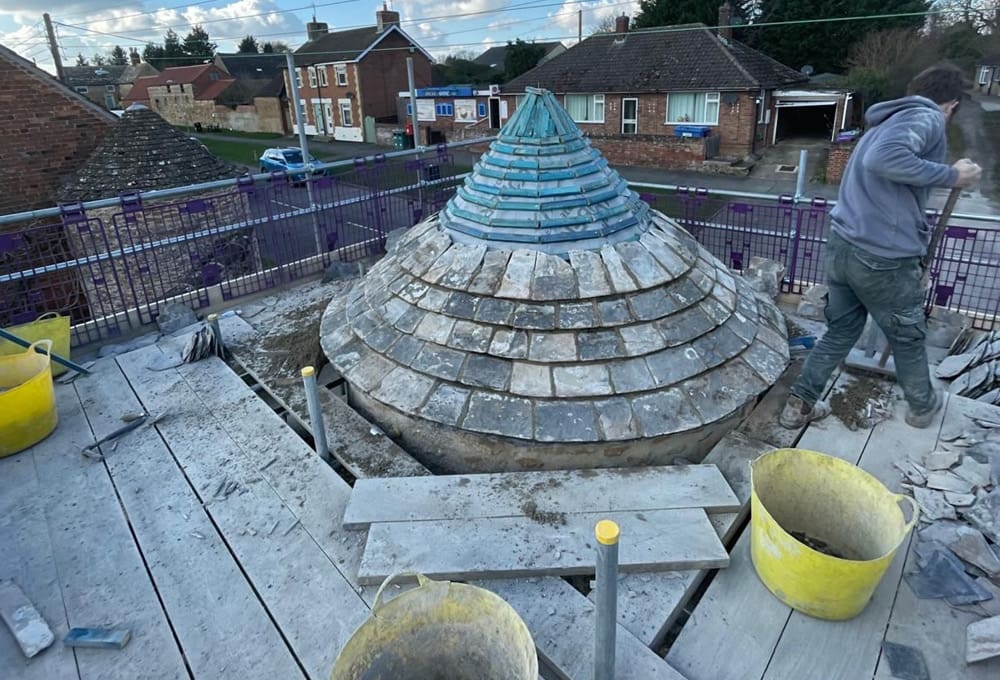 Restoration of Collyweston slate turret - in progress Restoration of Collyweston slate turret - in progress