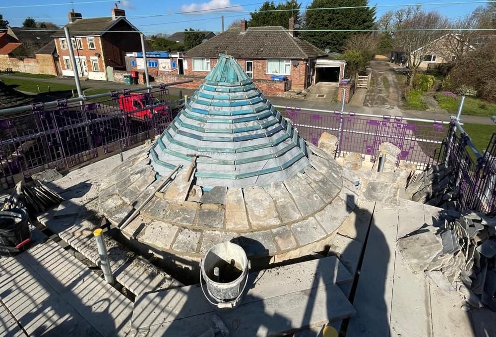 Restoration of Collyweston slate turret - in progress Restoration of Collyweston slate turret - in progress