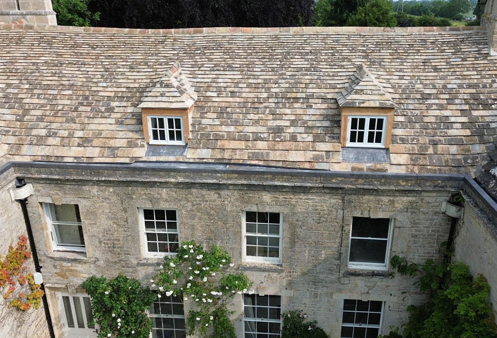 Bainton House Collyweston slate re-slate project - showing the devil eyes detail