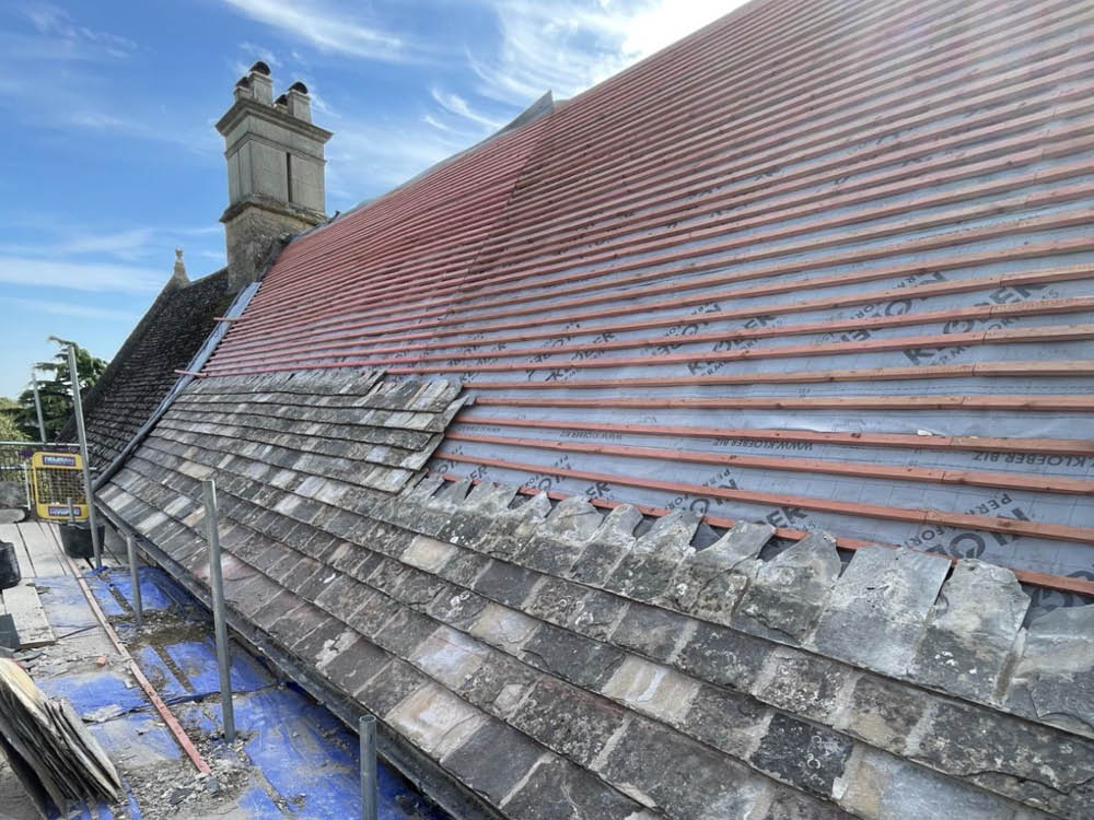 Collyweston re-slate Grade ll Listed Maor House in Northamptonshire - partially re-slated