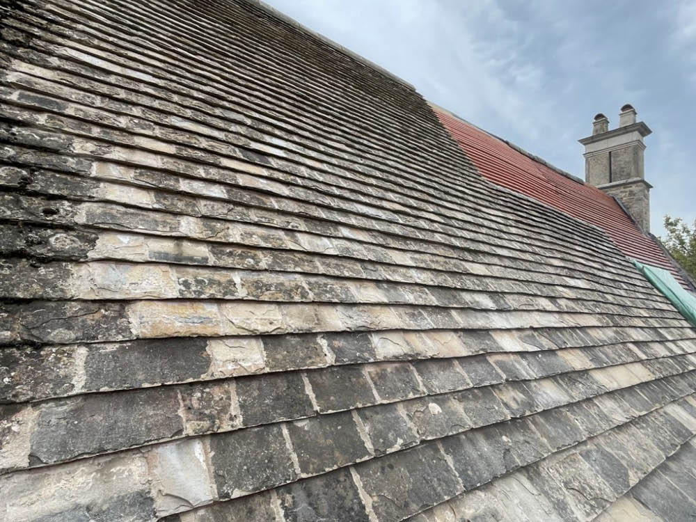 Collyweston re-slate Grade ll Listed Maor House in Northamptonshire - partially re-slated