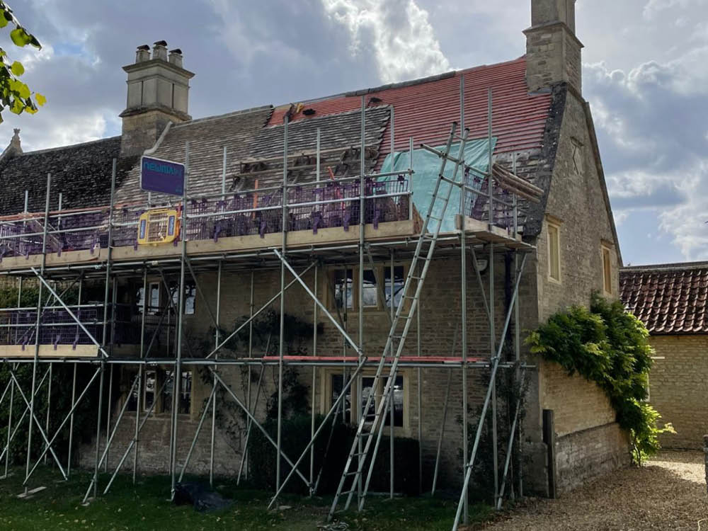 Collyweston re-slate Grade ll Listed Maor House in Northamptonshire - partially re-slated